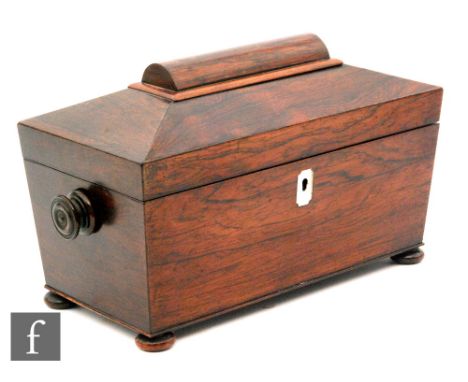 A 19th Century rosewood sarcophagal shaped tea caddy with associated glass mixing bowl and separate cannisters, on bun feet, 