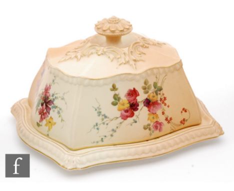 An early 20th Century Royal Worcester blush ivory butter dish and cover decorated with floral sprays with gadrooned edges and