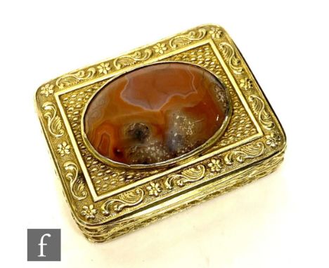 A George III hallmarked silver gilt metal vinaigrette of rectangular form, the hinged cover with a polished Scottish agate on