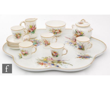 A 19th Century Royal Worcester part tete-a-tete set decorated with hand painted ferns comprising a large tray, sugar box, mil