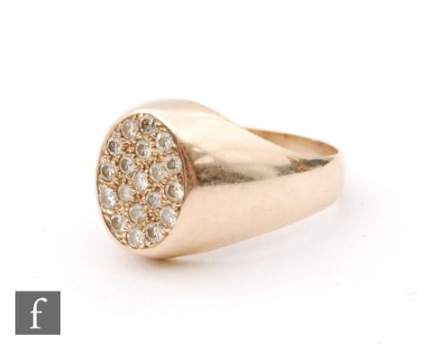 A 9ct hallmarked diamond set signet ring, oval pave diamond head to tapering plain shoulders, weight 4g, ring size O. 