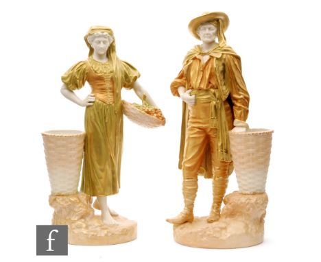 A pair of early 20th Century Royal Worcester figures of grape harvesters modelled by James Hadley, she holding a basket of gr