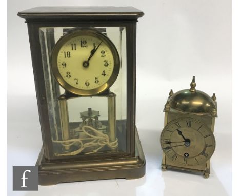 An early 20th Century brass and glazed cased mantle clock by Gustav Becker, No 2267133, circular Arabic dial with suspended p