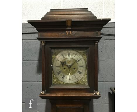 An 18th Century oak longcase clock with later associated 8-day movement, the hood with a later raised caddy top over the 12 i