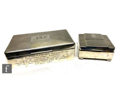Two hallmarked silver cigarette boxes, the first of square form with a stepped engine turned cover in the Art Deco style open