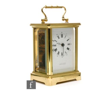 A 20th Century French brass carriage clock by T.N Hill &amp; Son, Morton-In-Marsh, on bracket plinth, height 11cm. 