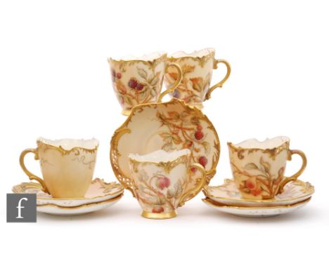 A set of five Royal Worcester shape 1471 coffee cups and saucers, each decorated with fruits and berries and floral sprays wi