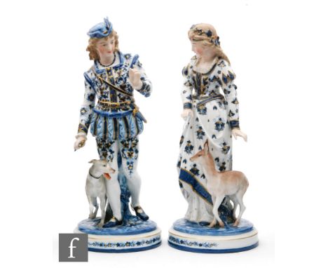 A pair of late 19th Century Scheibe-Alsbach figures of a lady and gentleman in medieval dress, she stood beside a deer, he be