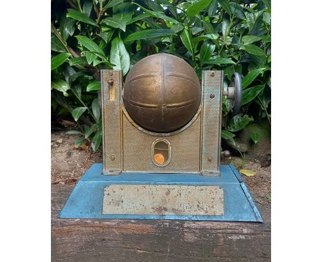 Vintage coin operated arcade game. Twist the globe, throw in a coin, press down the button, and find out from the colour of t