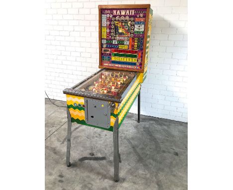 1973 Bally Hawaii Bingo machine in good working condition. Notable Features: Trap holes (25), Two Cards, 10 sideways magic li