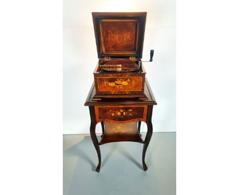 Porter disc music box on a stand in perfect working condition with no missing comb teeth. The music box and the stand have sc