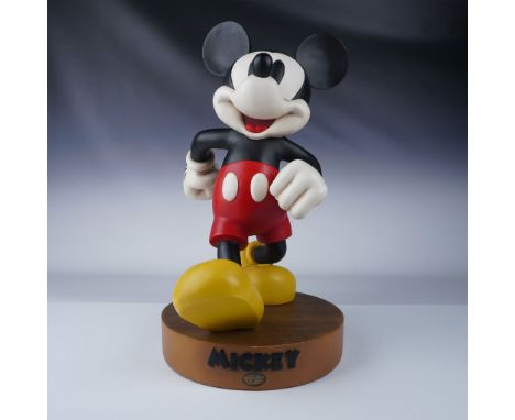 Vintage Mickey Mouse statue featuring a vibrant and classic design. The statue stands at 19"H, with an additional faux wood b