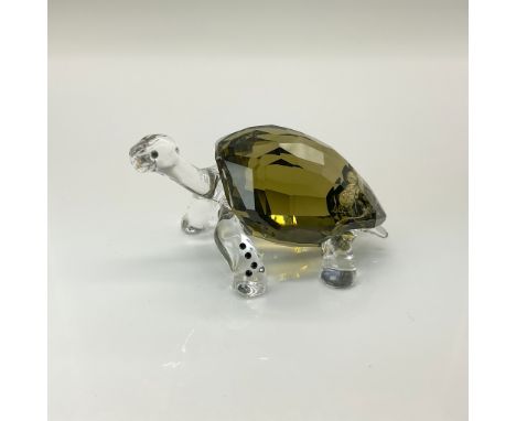 The tortoise is made from clear crystal for the head and legs, with a smoky quartz body. Event piece from 2010, signed by des
