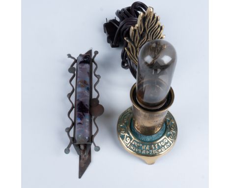 A classic Gary Rosenthal Mezuzah featuring a mostly purple fused glass center surrounded by fused pieces of brass and copper.