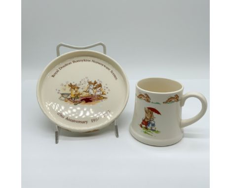 This charming lot features two Royal Doulton Bunnykins pieces, each adorned with delightful hand-painted scenes of the belove