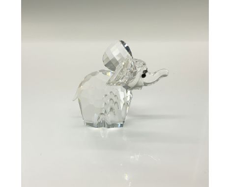Trumpeting pachyderm with a clear cut crystal body and black eyes. This item has its original box which measures 4"H x 5" dia