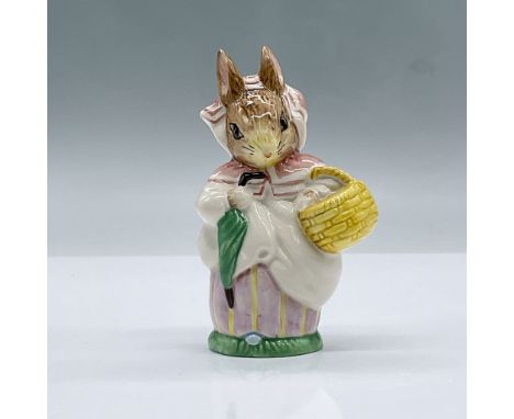 Glossy porcelain. Features a rabbit carrying an umbrella and basket. Royal Albert Beatrix Potter backstamp. This item has its