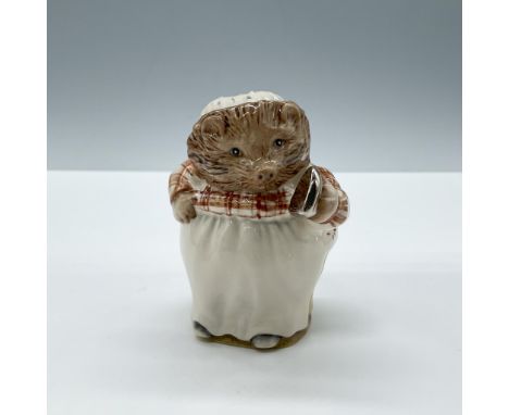 Glossy porcelain. The character is modeled in white and red patterned clothes with a silver iron. Beswick Beatrix Potter back