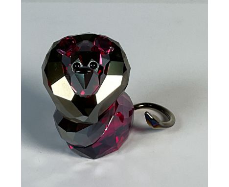 Charming lead crystal lion figurine is part of the Lovlot Circus collection. His vibrant fuchsia golden shadow body and jet e