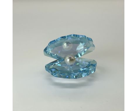 Blue crystal clam, open with a faux pearl inside. Swarovski backstamps. This item has its original box. Box measures: 2.5"H x