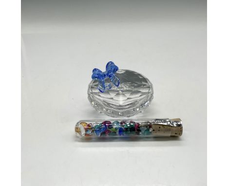 Part of the Exquisite Accents group is a lidded heart shaped box adorned with blue crystal ribbon. Tube of multicolored cryst