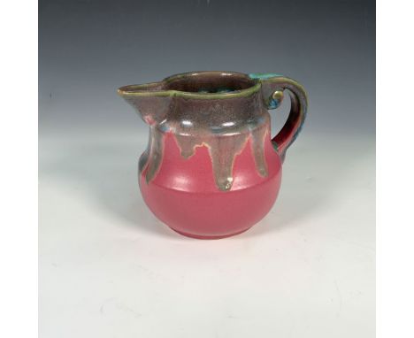 This captivating Fulper Pottery pitcher is a fine example of the brand's signature drip-glaze technique. The pitcher features
