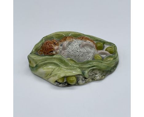 Glossy porcelain. Features a little mouse in a pea pod. Stamped Royal Albert Beatrix Potter. This item has its original box, 