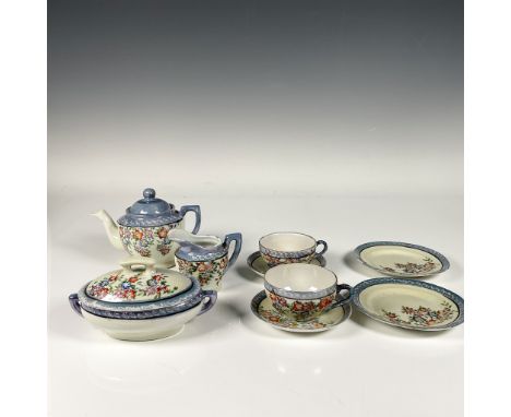 Lusterware set includes a teapot with lid, a creamer, a soup bowl with lid, two tea cup, two saucers, and two plates. Made in