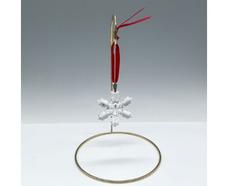 Rare annual Christmas edition designed as snowflake with 1992 etched mark hung from a red satin ribbon. This item has its ori