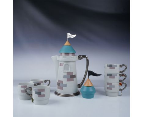 Charming Disney castle-themed ceramic coffee set featuring a tall castle-inspired coffee pot with lid, a creamer marked Cream