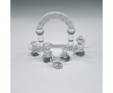 Clear crystal figurines of mother, child and father (7475 NR 001) with shepherd (153963) and angel (153971) looking on. Arch 