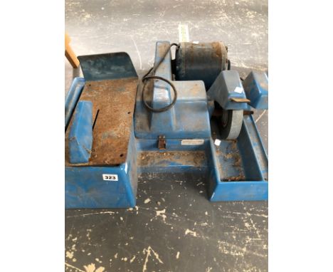 A MOTOR POWERED WET STONE GRINDER. 
