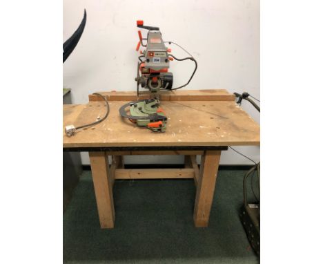 A DEWALT POWER SHOP DW1501 CHOP SAW ON BENCH WITH INSTRUCTION MANUAL.- please be aware this tool does not appear to function.