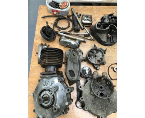 A LARGE COLLECTION OF VINTAGE MOTORCYCLE ENGINE PARTS AND GEAR BOXES INC. VELOCETTE, JAP, LUCAS,  TRIUMPH PARTS, TWO GEAR BOX