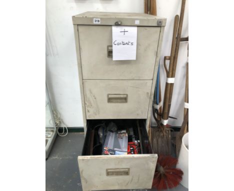 A FILING CABINET CONTAINING VARIOUS HAND AND POWER TOOLS. 