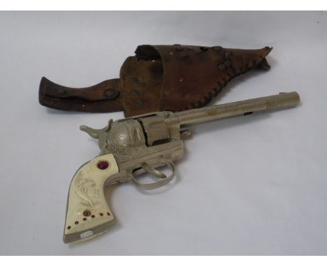 Vintage Western toy pistol with holster