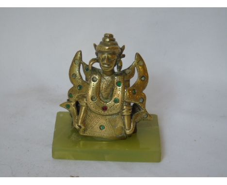 Oriental figure of a god on a jade base and a jade carved bird
