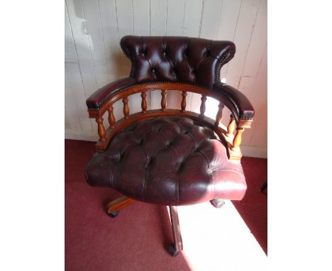Red leather button back captain style swivel chair
