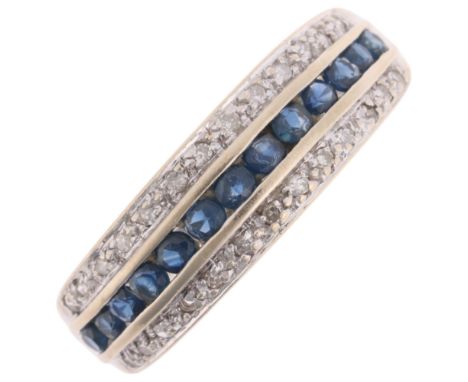 A 9ct white gold sapphire and diamond band ring, channel set with round-cut sapphires flanked by 2 rows of round-cut diamonds