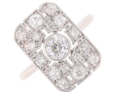 An Art Deco 18ct gold and platinum diamond plaque ring, the rectangular openwork panel millegrain set with old European and s
