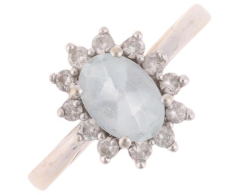 A 14ct white gold aquamarine and diamond cluster ring, claw set with oval mixed-cut aquamarine and modern round brilliant-cut