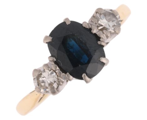 An 18ct gold three stone sapphire and diamond ring, claw set with oval mixed-cut sapphire and modern round brilliant-cut diam