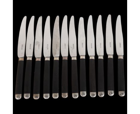 A set of 12 French silver-mounted ebony-handled dinner knives, by Tourcn of Paris, with steel blades, blade length 14.5cmEdge