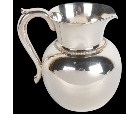 An American sterling silver three and a half pint water/wine jug, by A Stowell & Co, height 17cm, 15.7ozA few extremely light