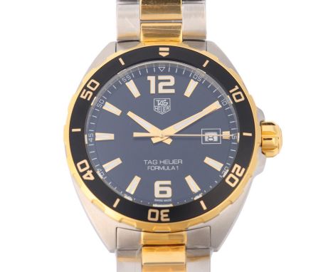 TAG HEUER - a gold plated stainless steel Formula 1 quartz calendar bracelet watch, ref. WAZ1121, black dial with gilt halfly