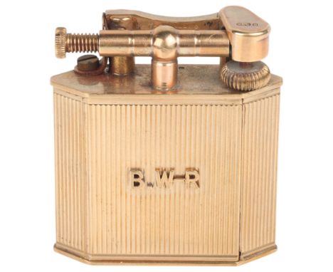 ALFRED DUNHILL - an Art Deco 9ct gold lighter, maker AD, London 1947, the geometric lozenge body with fluted decoration, pate