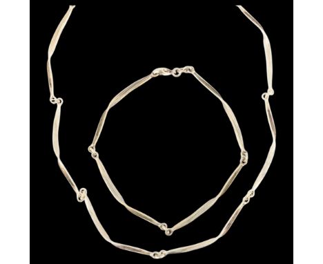 FLORAL DANICA - a Danish naturalist vermeil sterling silver necklace and bracelet set, each panel modelled as twisted leaves,