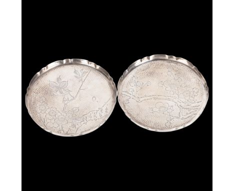 A pair of Japanese silver drink's coasters, with engraved blossom decoration, 8cm, 2oz totalNo damage or repair, only light s