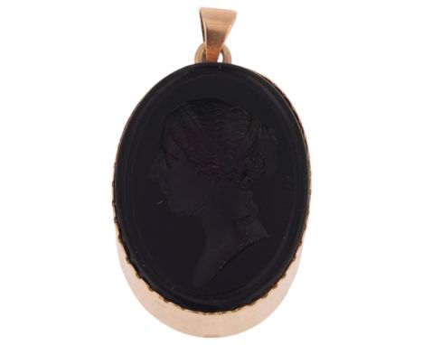 AFTER NATHANIEL MARCHANT - an amethyst glass portrait intaglio pendant, depicting profile of a lady, signed, in unmarked 9ct 