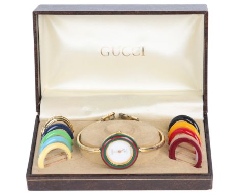 GUCCI - a Vintage gold plated stainless steel quartz bangle wristwatch, ref. 1100-L, circa 1988, white dial with gilt pencil 